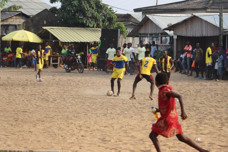 The community engages in a football competition sponsored by gas companies. 